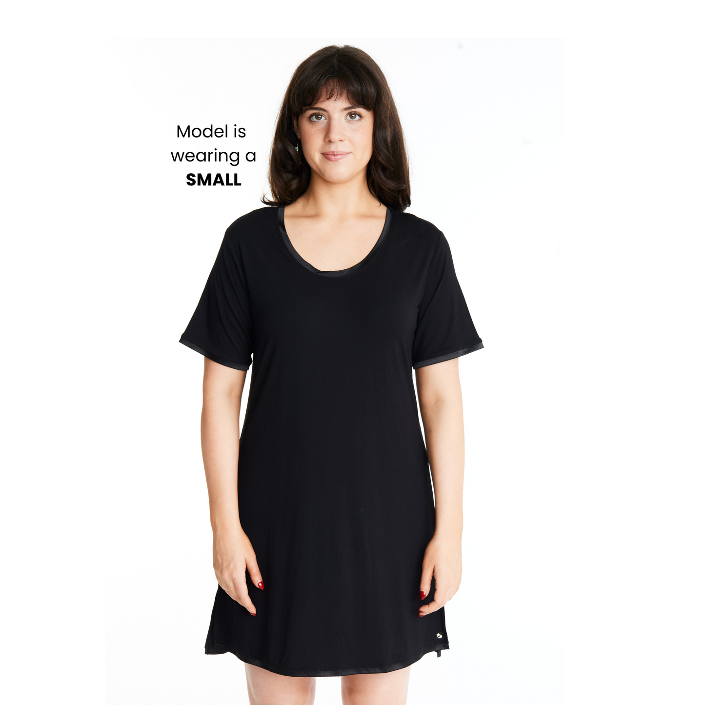A woman wearing a short-sleeved, scoop-neck, knee-length nightie in a solid color, with satin trim detailing.