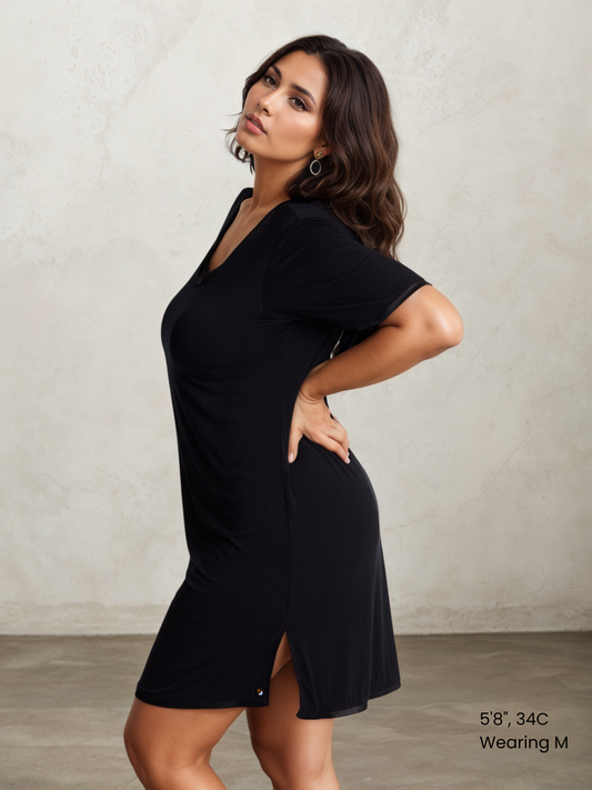 A woman wearing a short-sleeved, scoop-neck, knee-length nightie in a solid color, with satin trim detailing.