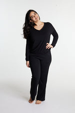 Woman in midnighties tuxedo set in color Midnight