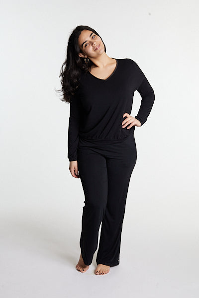 Woman in midnighties tuxedo set in color Midnight