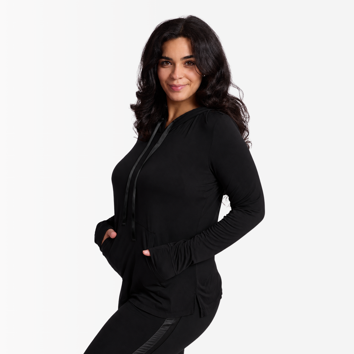 Woman wearing Midnight (black) bamboo Hoodie with satin stripe on oversized hood and satin drawstrings