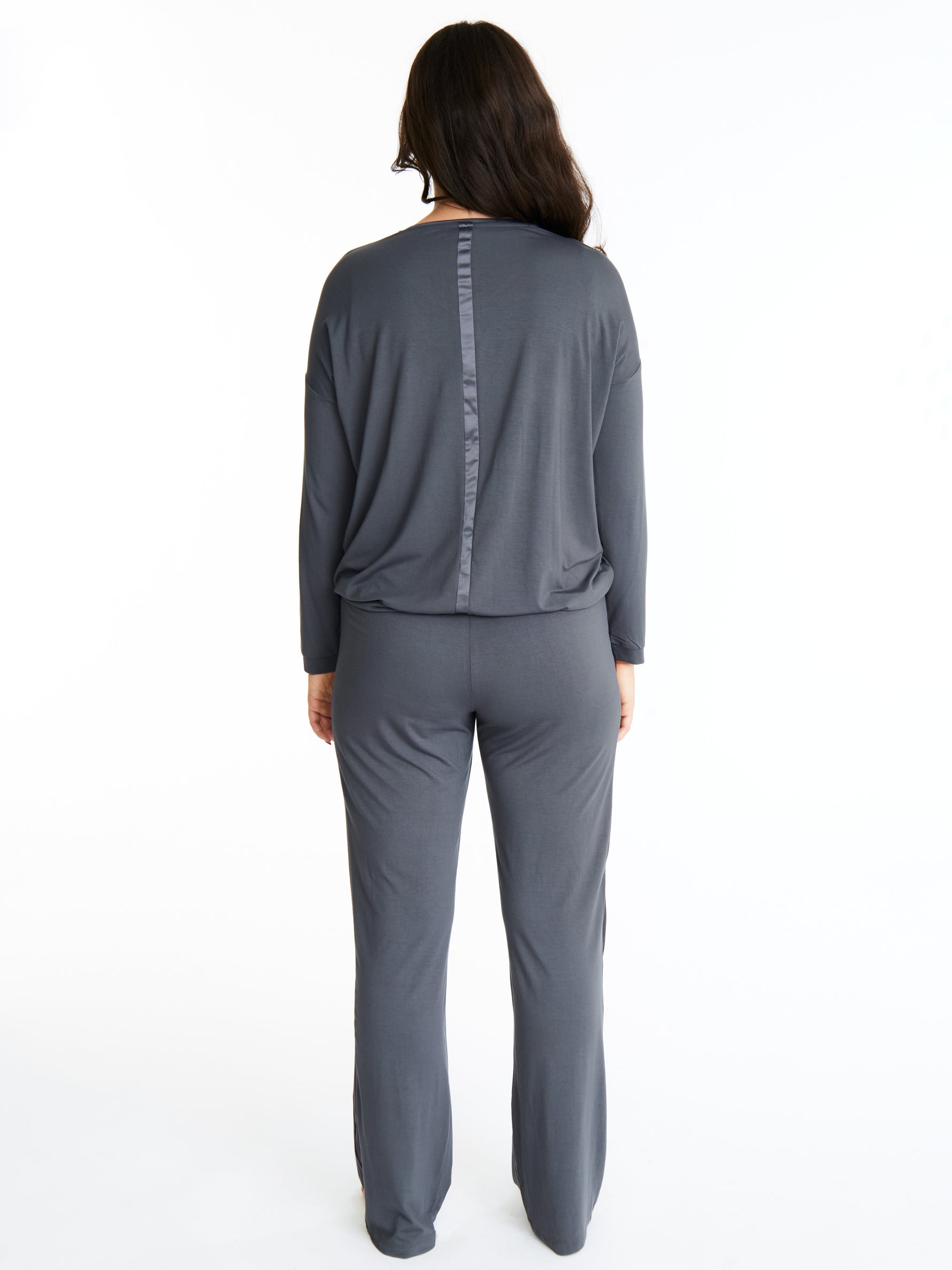 Woman in Midnighties Tuxedo-striped lounge set in color Moonshadow