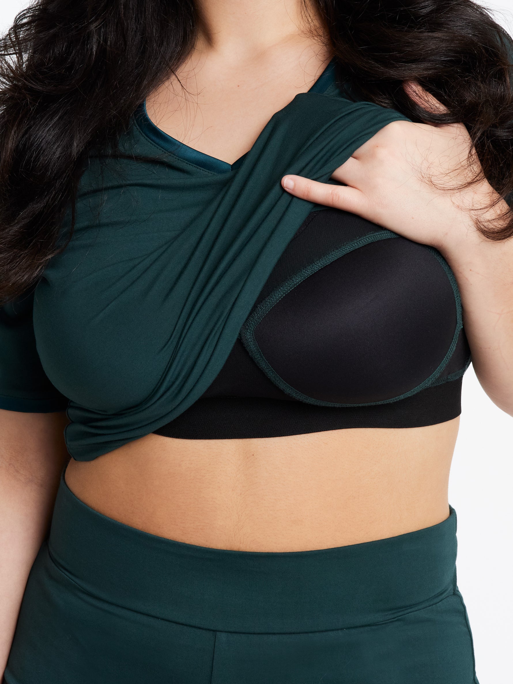 Women in V neck Midnighties shorts set in Dusky Jade showing padded support
