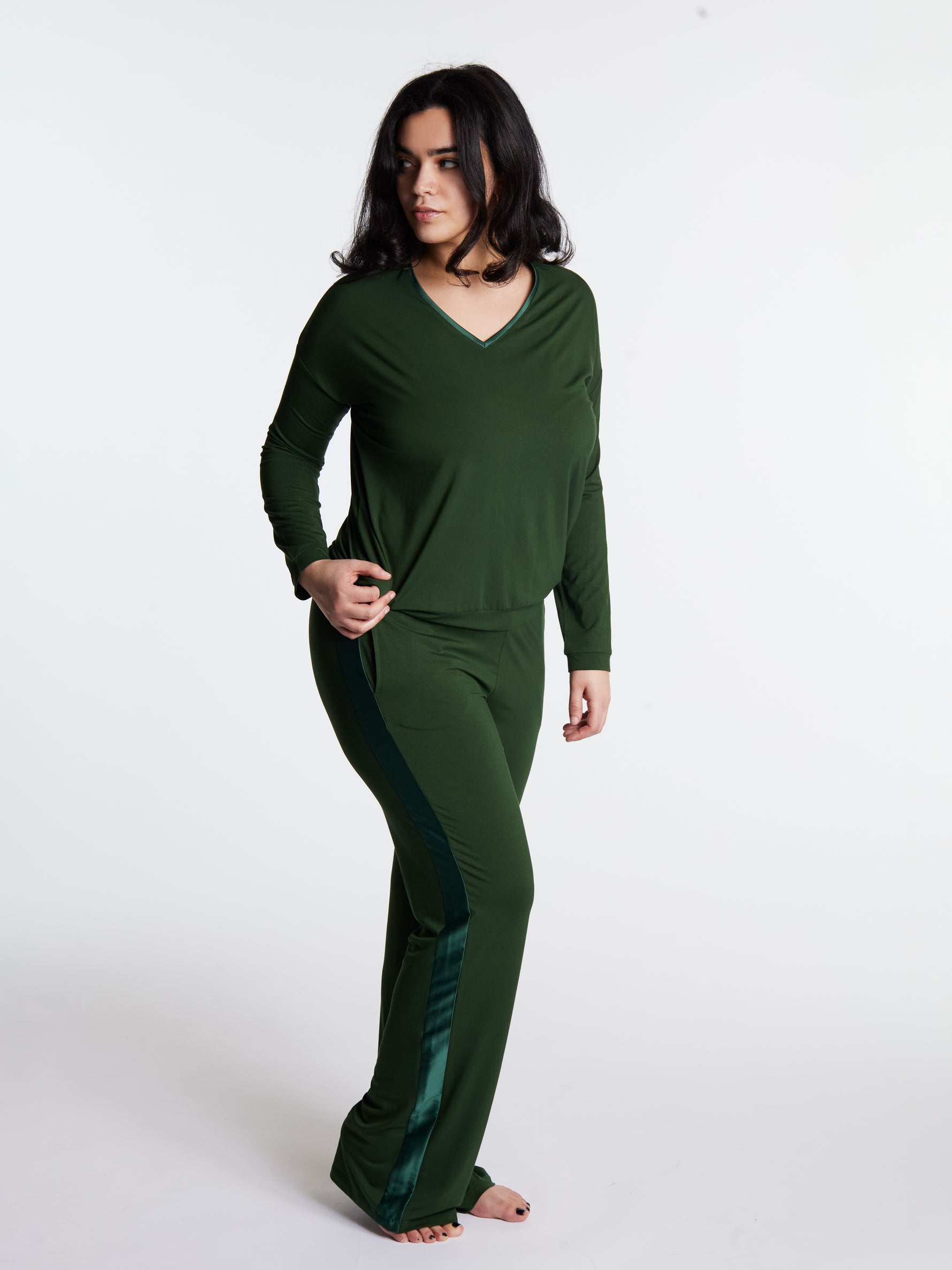 Woman in midnighties tuxedo set in color Forest Whisper