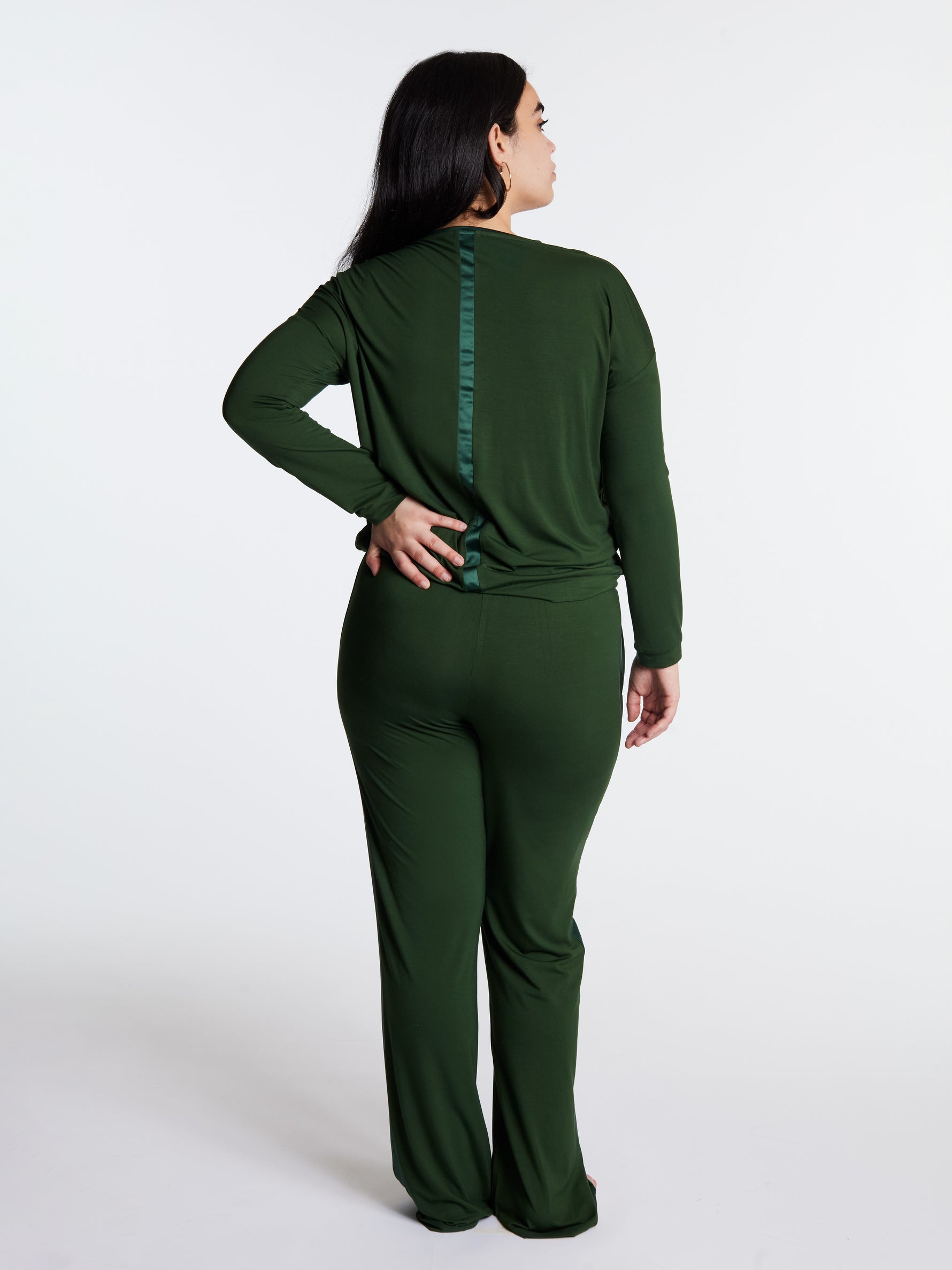 Woman in midnighties tuxedo set in color Forest Whisper