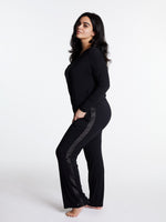 Woman in midnighties tuxedo set in color Midnight