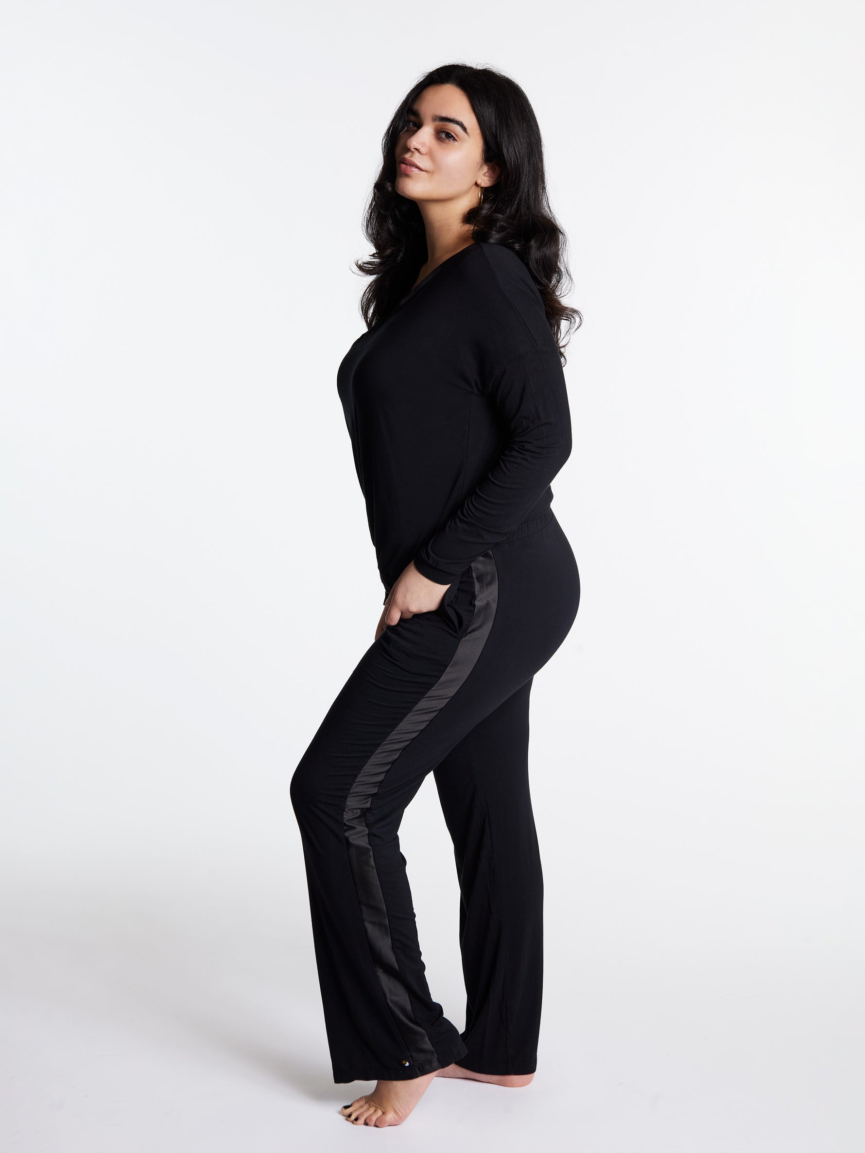 Woman in midnighties tuxedo set in color Midnight