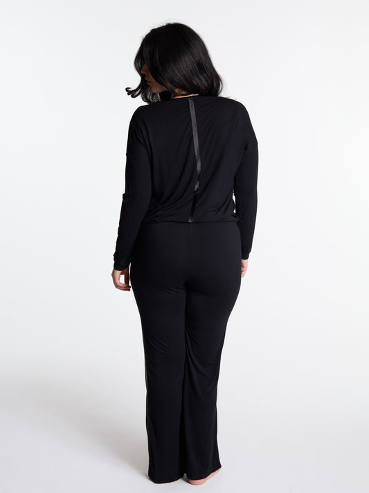 Woman in midnighties tuxedo set in color Midnight
