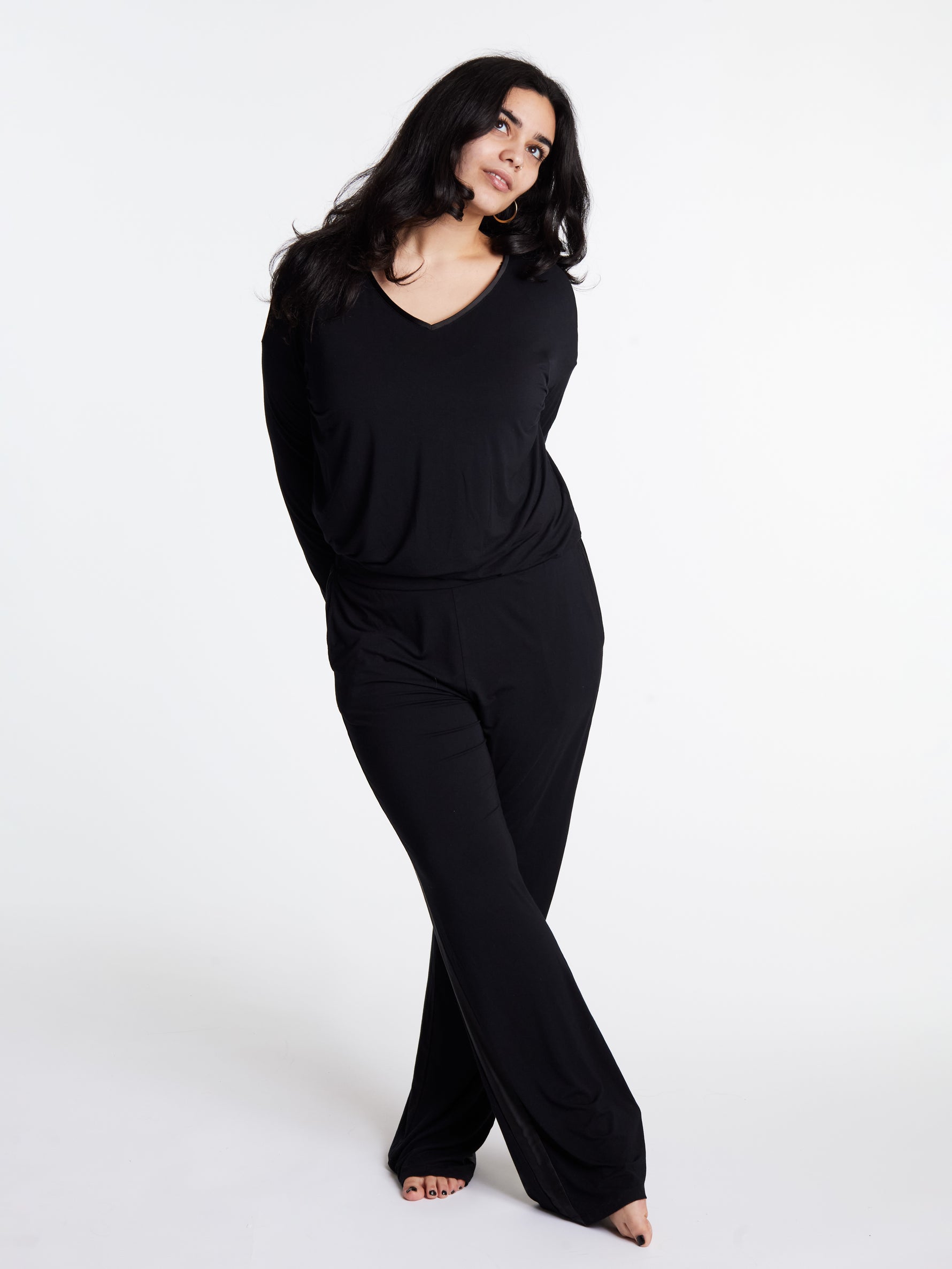 Woman in midnighties tuxedo set in color Midnight