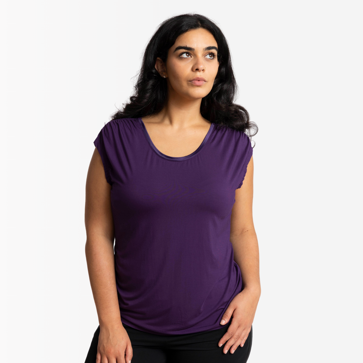 Woman in Ruched shoulder bamboo top in Twilight against a white photography background