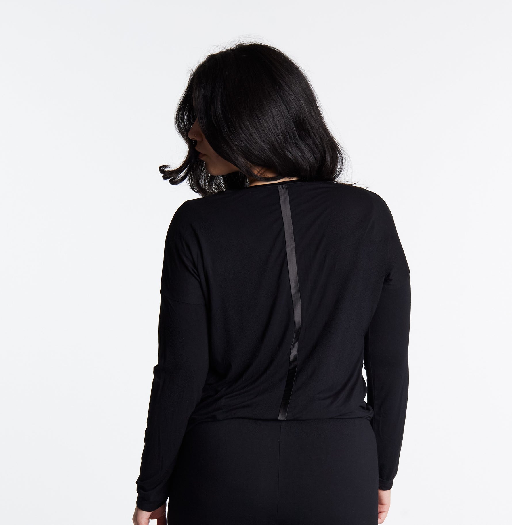 Woman in Midnighties long sleeve Tuxedo-striped top in color Midnight