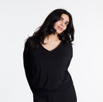 Woman in Midnighties long sleeve Tuxedo-striped top in color Midnight