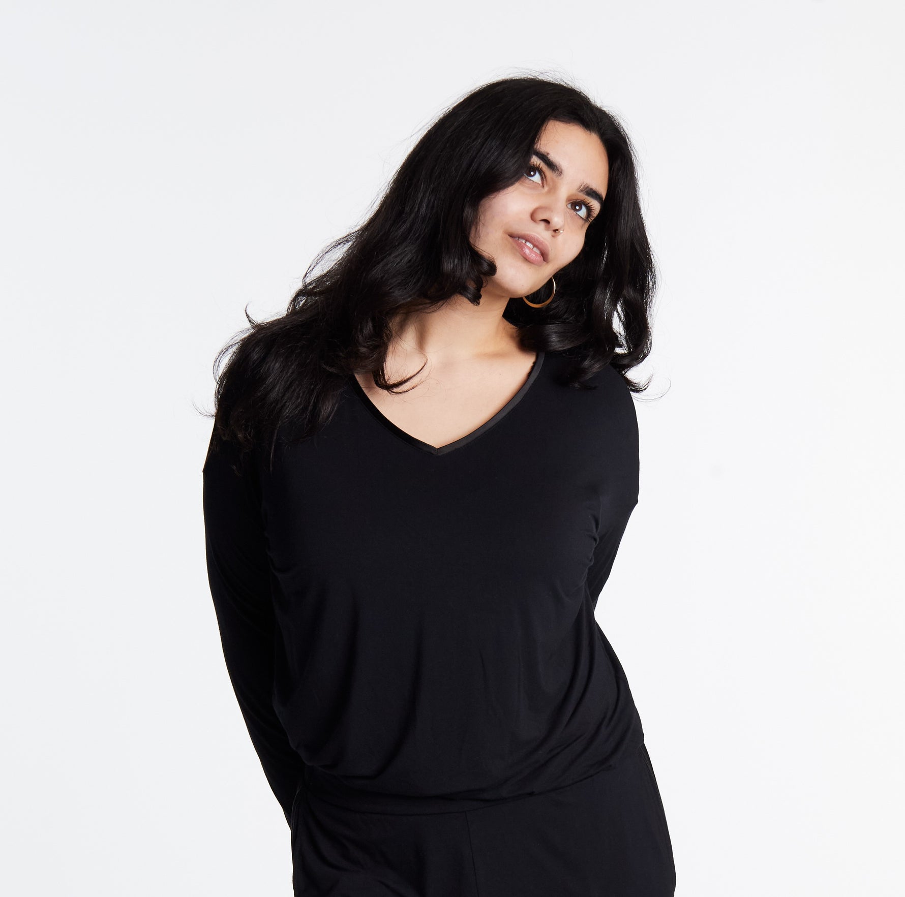 Woman in Midnighties long sleeve Tuxedo-striped top in color Midnight