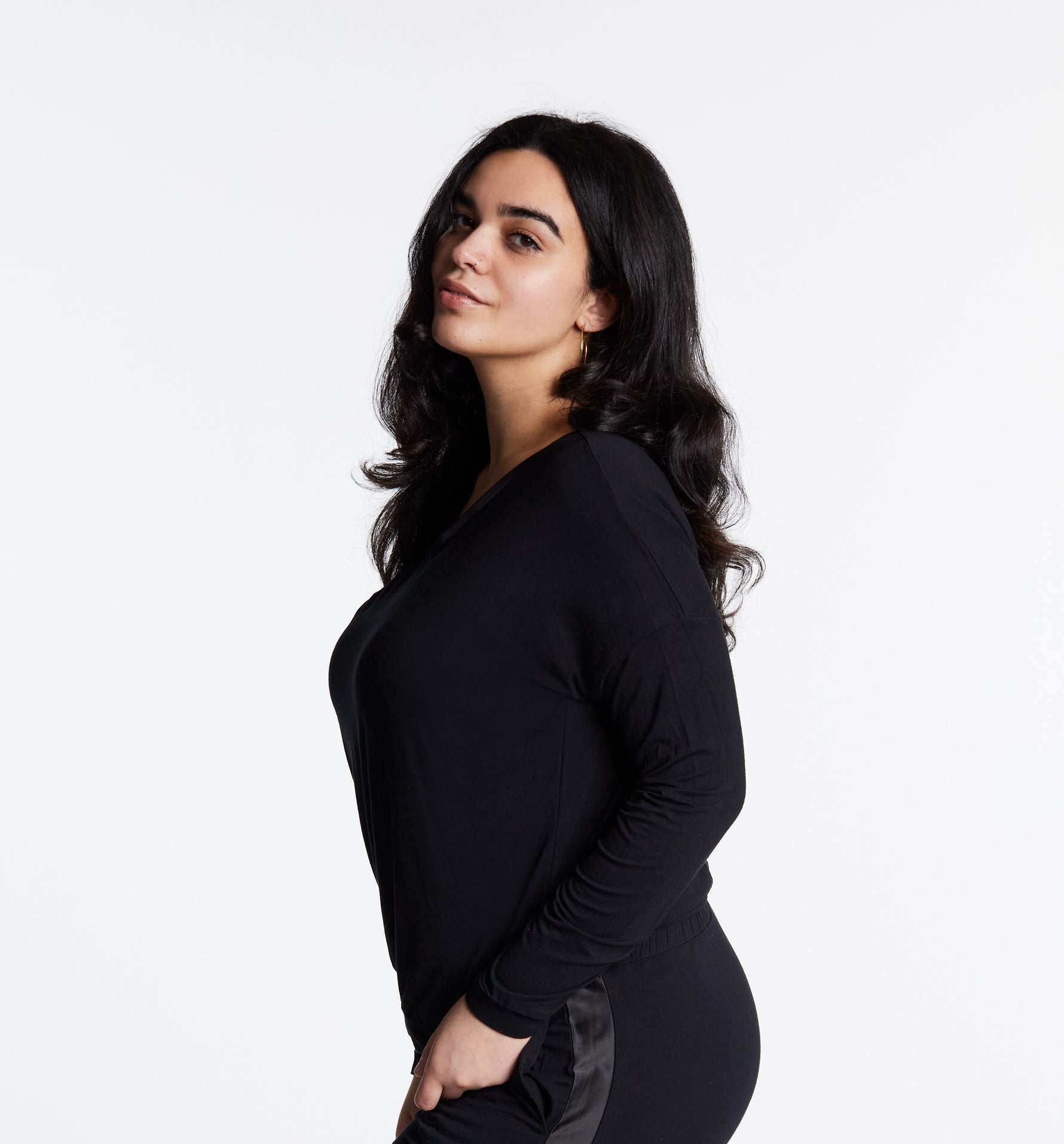 Woman in Midnighties long sleeve Tuxedo-striped top in color Midnight
