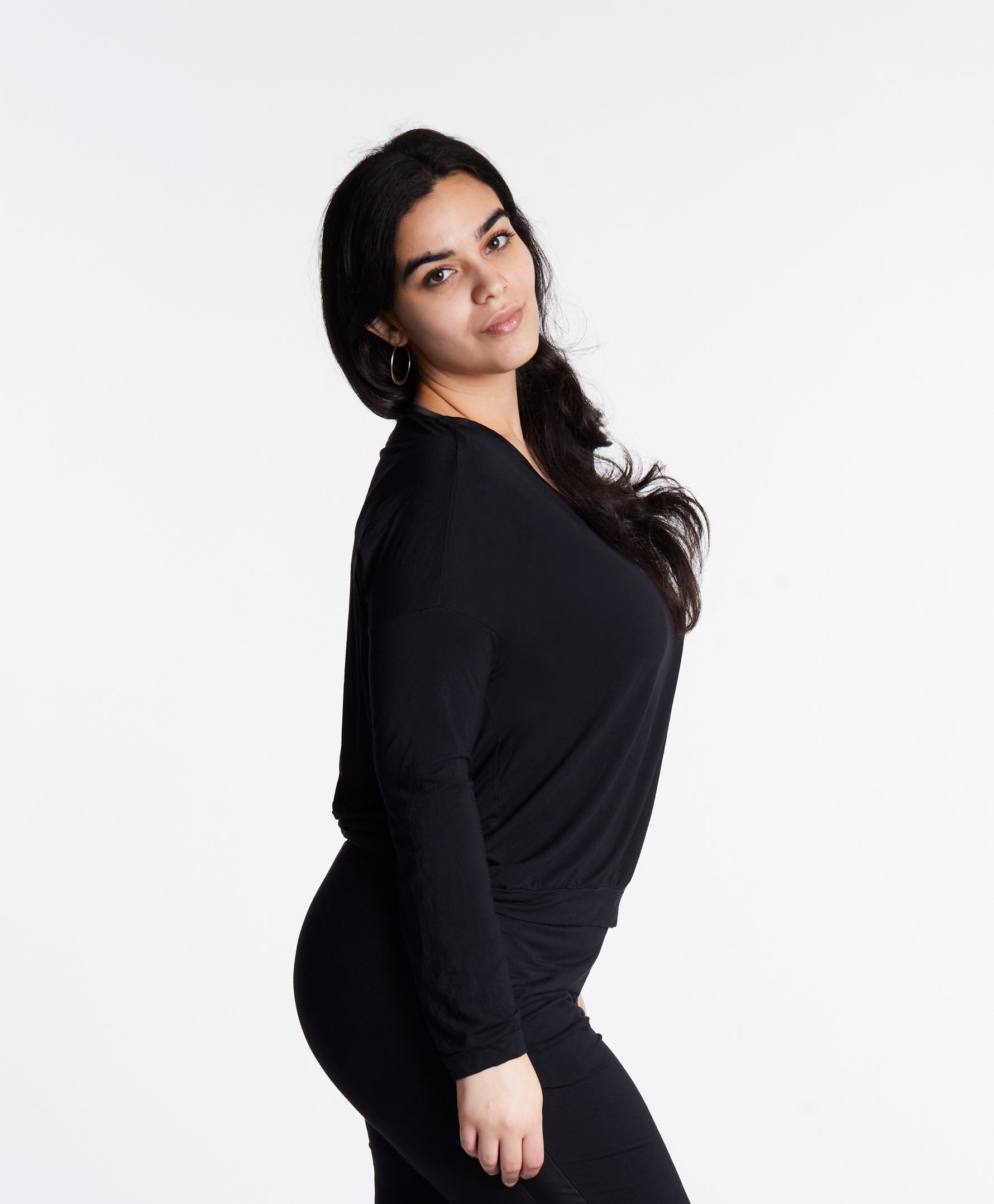 Woman in Midnighties long sleeve Tuxedo-striped top in color Midnight