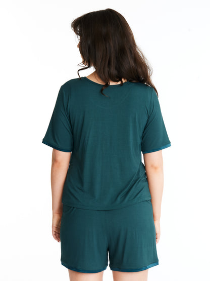 Woman in Midnighties shorts set in Dusky Jade